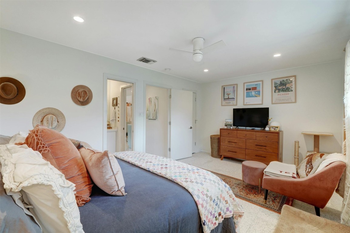 1208 Enfield Road, Unit 202 Austin, TX 78703 - Photo 14 of 19 a bedroom with a bed and a couch