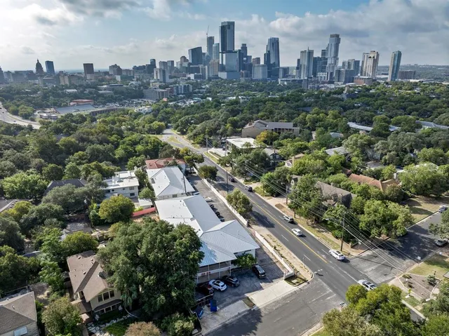 an aerial view of city and green space