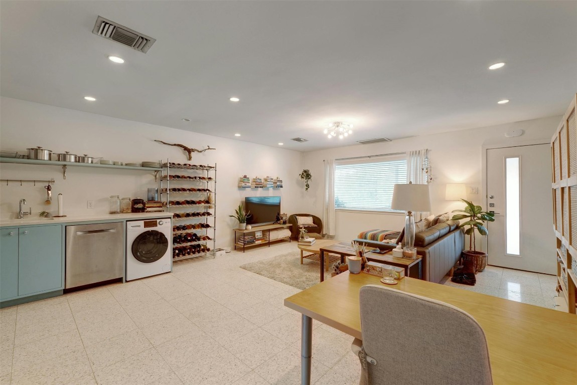 1208 Enfield Road, Unit 202 Austin, TX 78703 - Photo 4 of 19 a living room with furniture and a flat screen tv