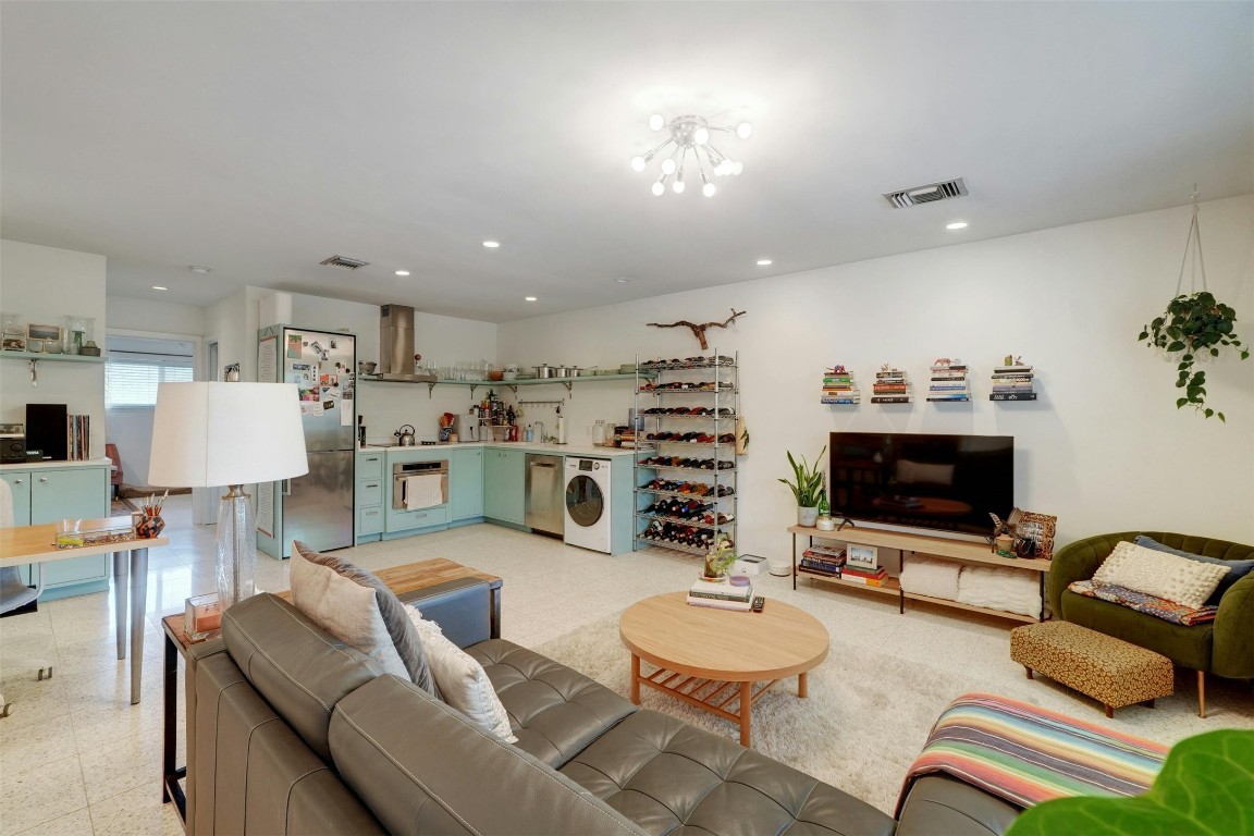 1208 Enfield Road, Unit 202 Austin, TX 78703 - Photo 5 of 19 a living room with furniture and a flat screen tv