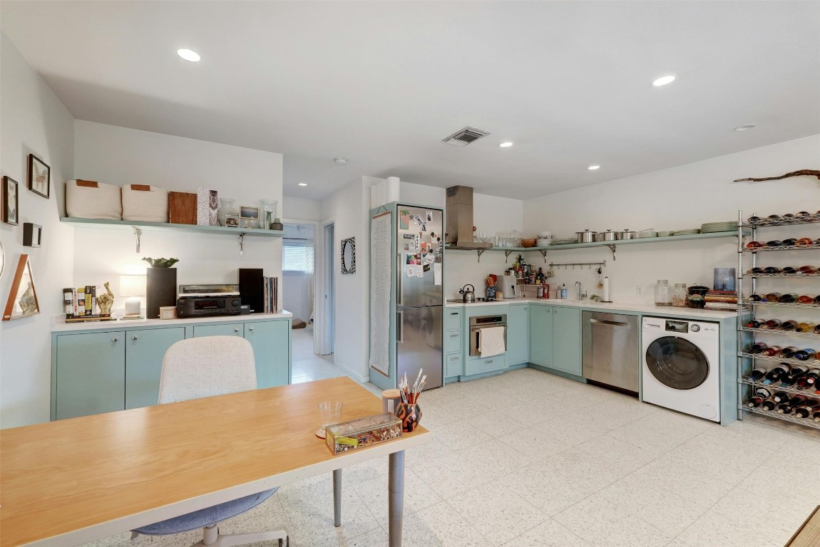 1208 Enfield Road, Unit 202 Austin, TX 78703 - Photo 6 of 19 a kitchen with refrigerator and cabinets