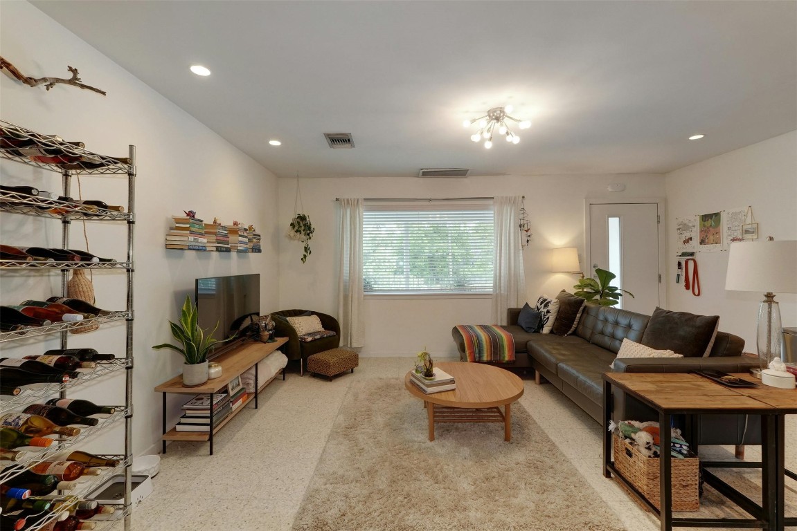 1208 Enfield Road, Unit 202 Austin, TX 78703 - Photo 8 of 19 a living room with furniture a rug and a window