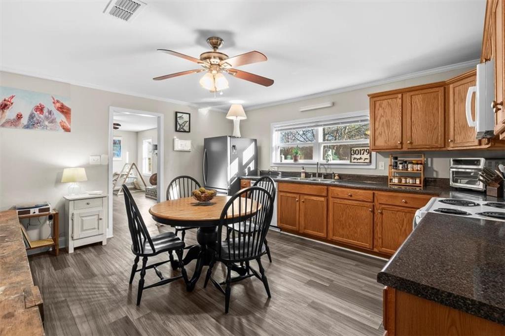 718 Baskin Road Temple, GA 30179 - Photo 11 of 50 a view of a dining room with furniture window and wooden floor