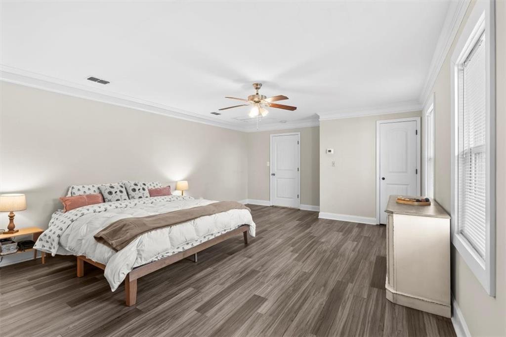 718 Baskin Road Temple, GA 30179 - Photo 20 of 50 a bedroom with a bed and a chandelier