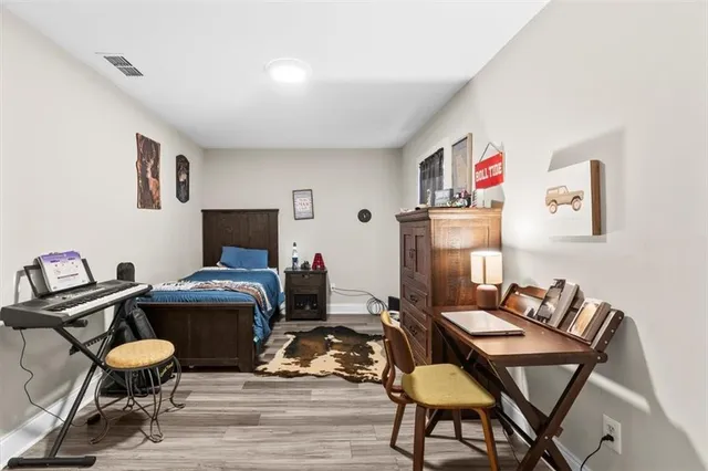 a work room with furniture and wooden floor