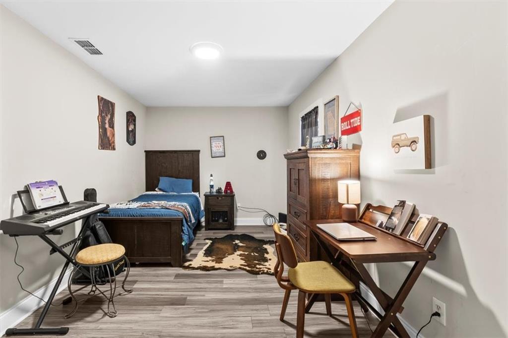 718 Baskin Road Temple, GA 30179 - Photo 26 of 50 a work room with furniture and wooden floor