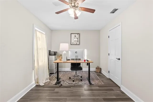 a view of a dining room with furniture and window