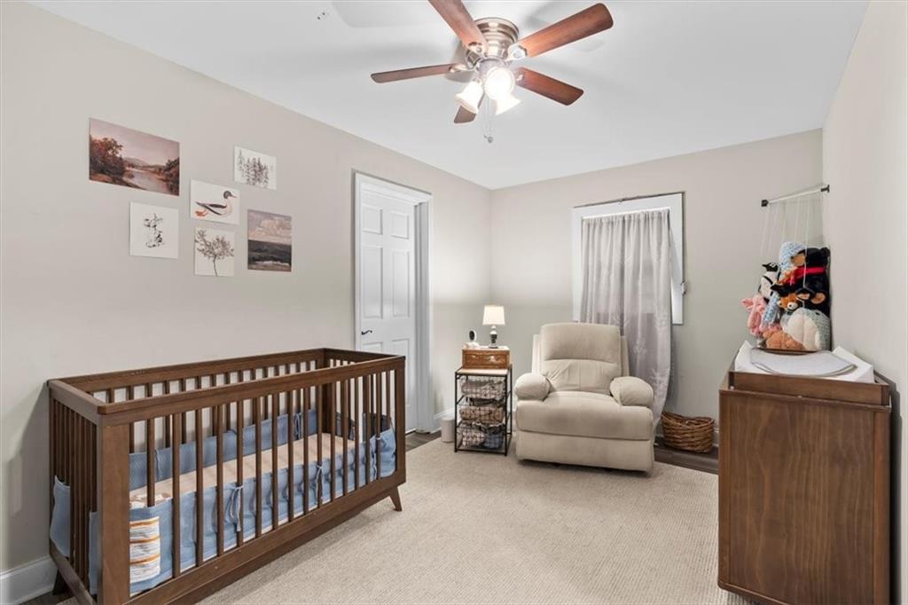 718 Baskin Road Temple, GA 30179 - Photo 28 of 50 a bedroom with furniture and a chandelier fan