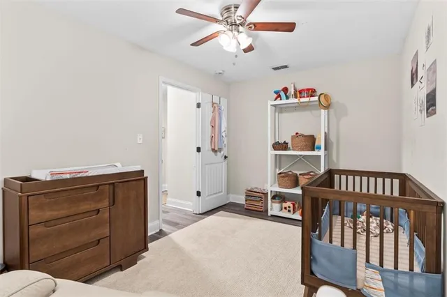 a bedroom with furniture and a chandelier