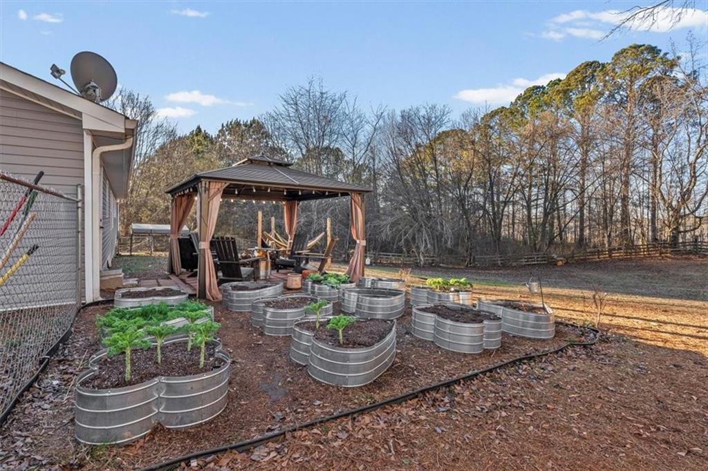 718 Baskin Road Temple, GA 30179 - Photo 35 of 50 a front view of a house with sitting garden