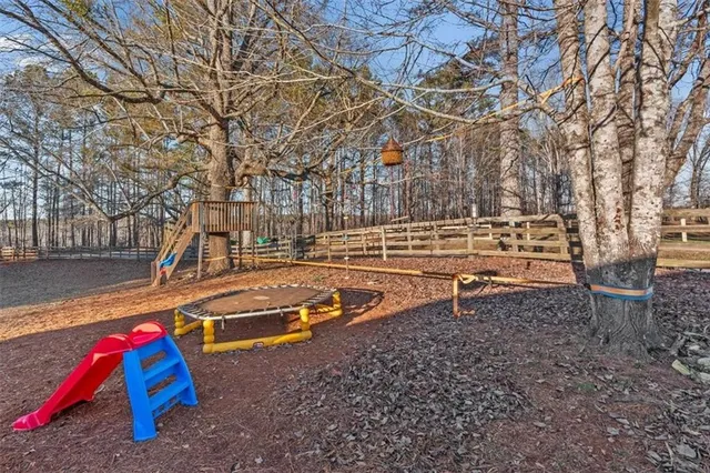 a view of backyard with swimming pool
