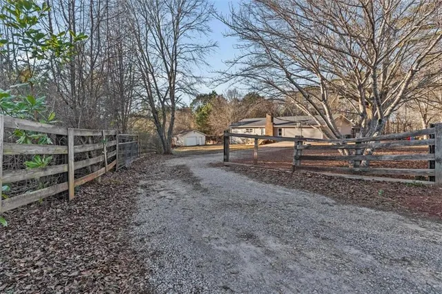a backyard of a house with lots of green space