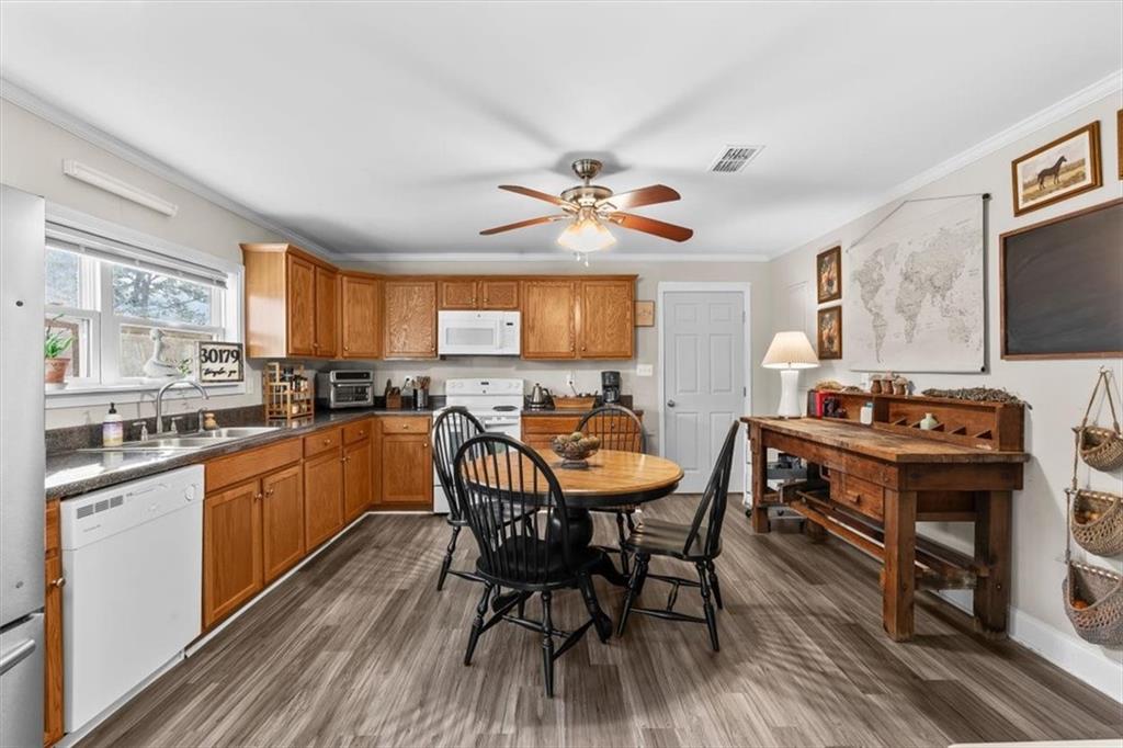 718 Baskin Road Temple, GA 30179 - Photo 9 of 50 a view of a dining room with furniture window and wooden floor