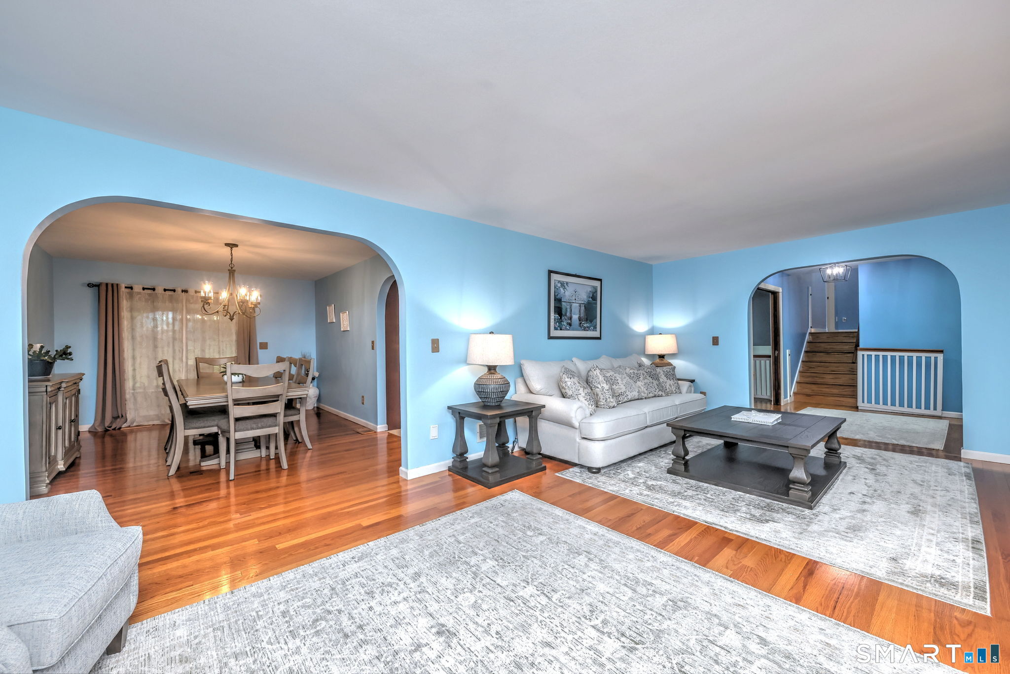 2262 Ridge Road North Haven, CT 06473 - Photo 5 of 40 a living room with furniture and a dining table with wooden floor