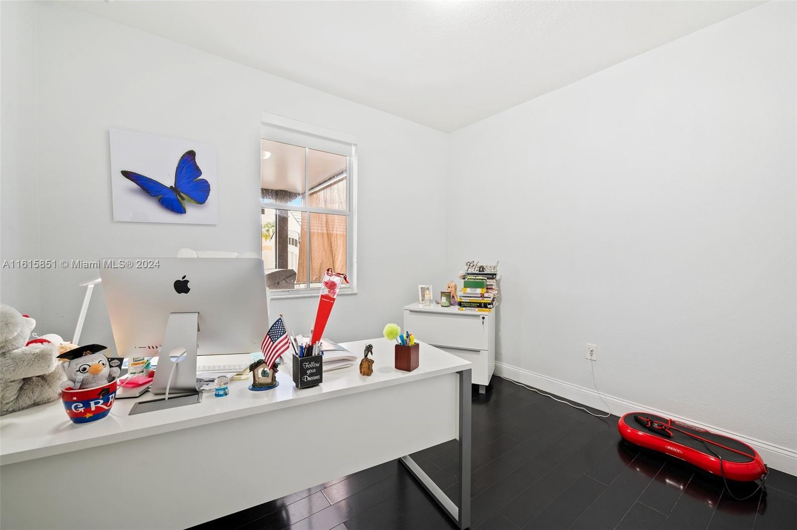 24044 Southwest 107th Court Homestead, FL 33032 - Photo 18 of 26 a room with furniture and a wooden floor