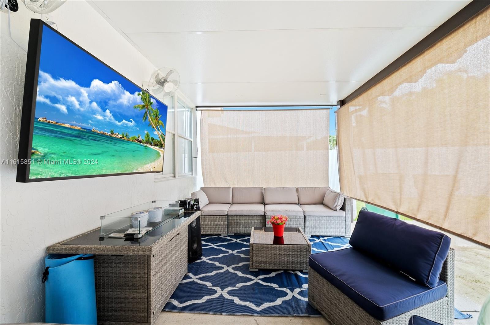 24044 Southwest 107th Court Homestead, FL 33032 - Photo 20 of 26 a living room with furniture and a flat screen tv