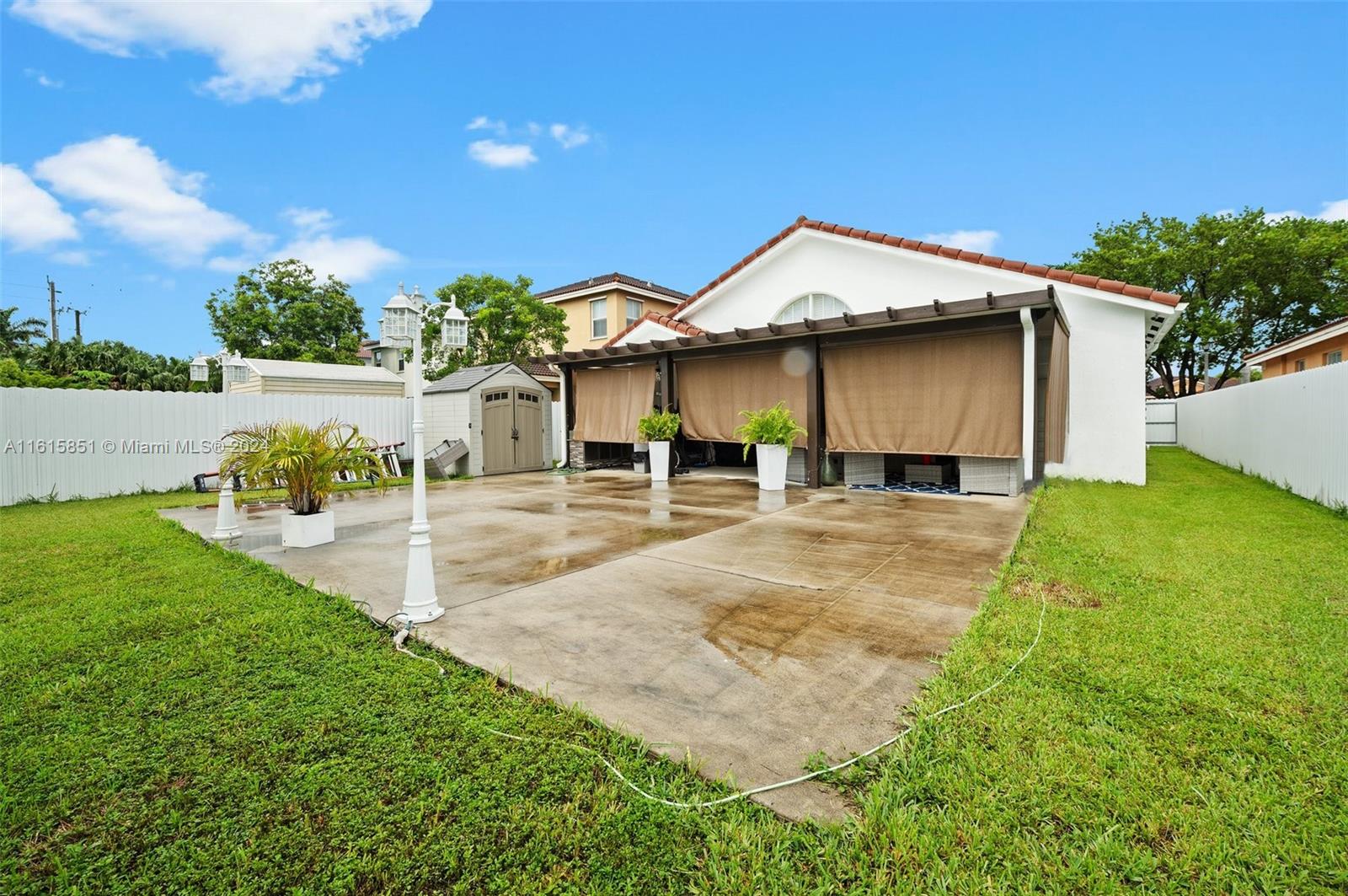 24044 Southwest 107th Court Homestead, FL 33032 - Photo 25 of 26 a view of a house with pool and a yard