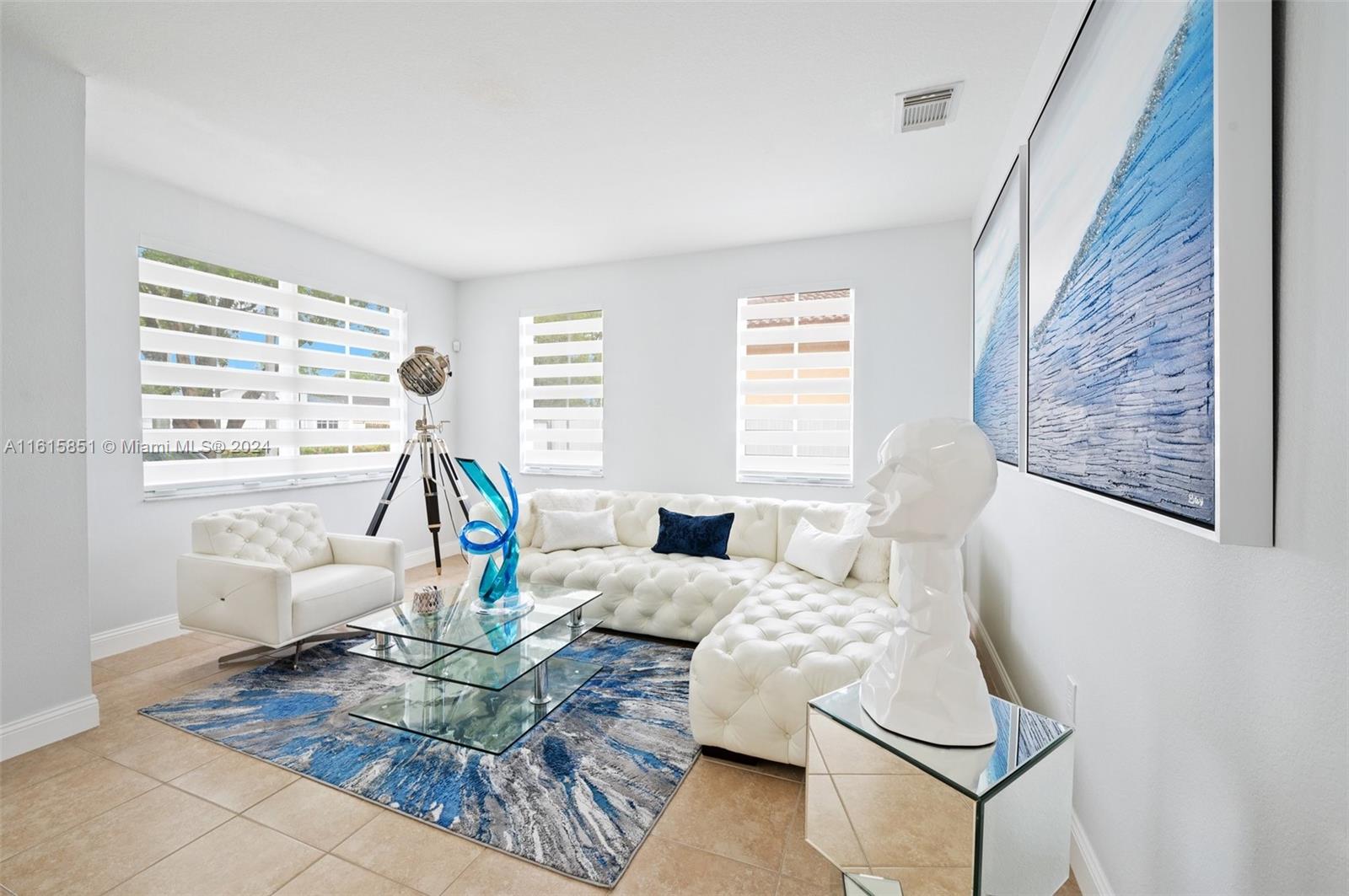 24044 Southwest 107th Court Homestead, FL 33032 - Photo 4 of 26 a living room with furniture and a large window