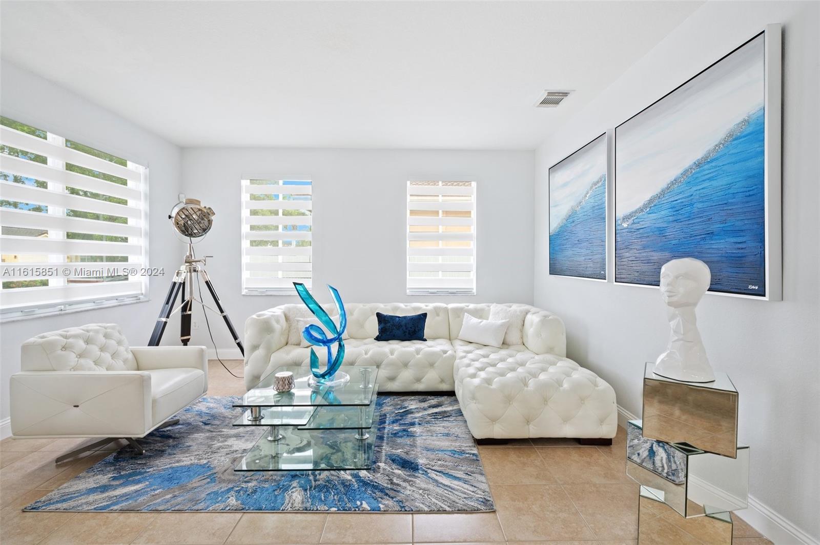 24044 Southwest 107th Court Homestead, FL 33032 - Photo 5 of 26 a living room with furniture and a wooden floor