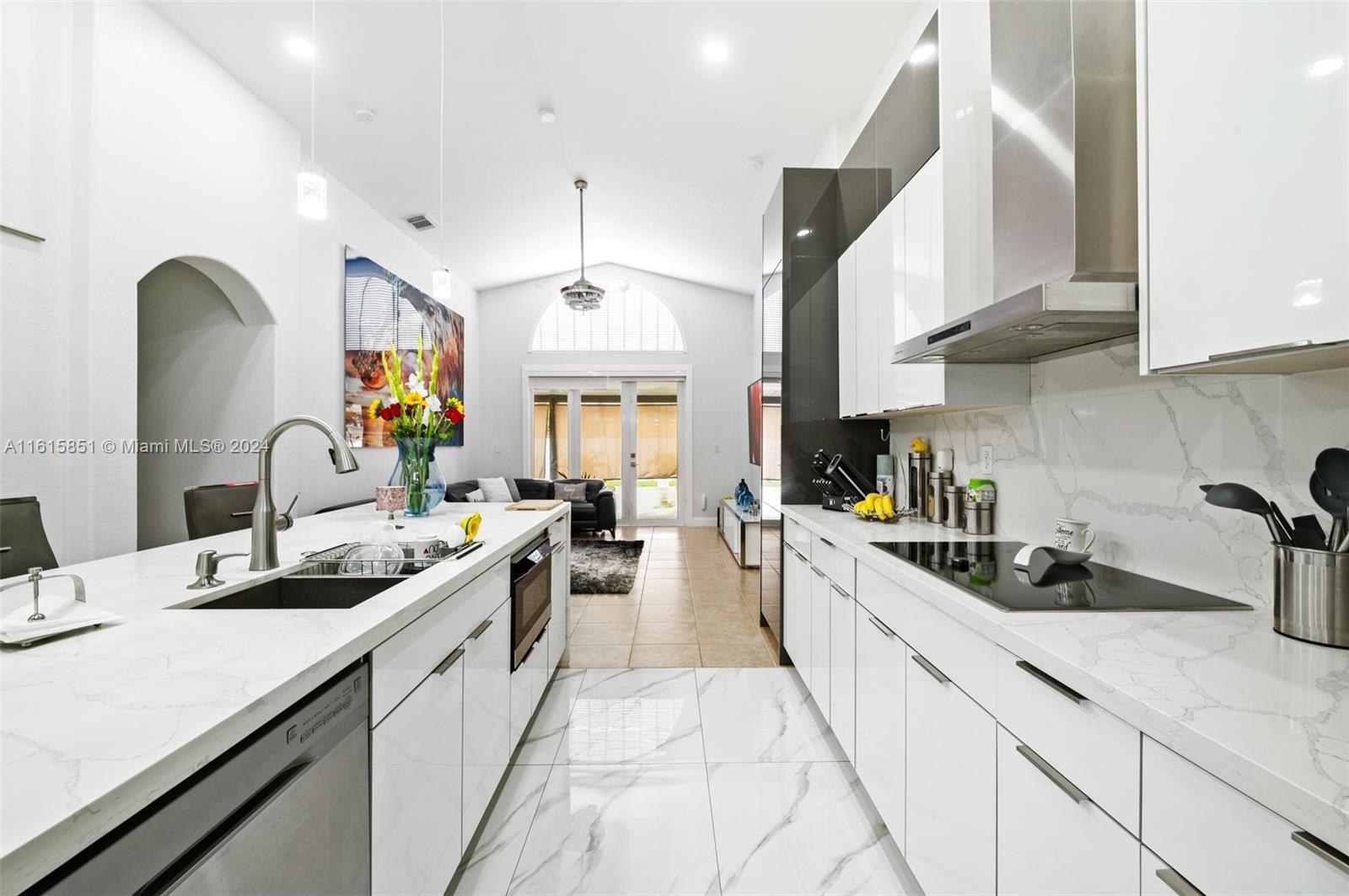 24044 Southwest 107th Court Homestead, FL 33032 - Photo 8 of 26 a kitchen with stainless steel appliances a sink a stove and cabinets