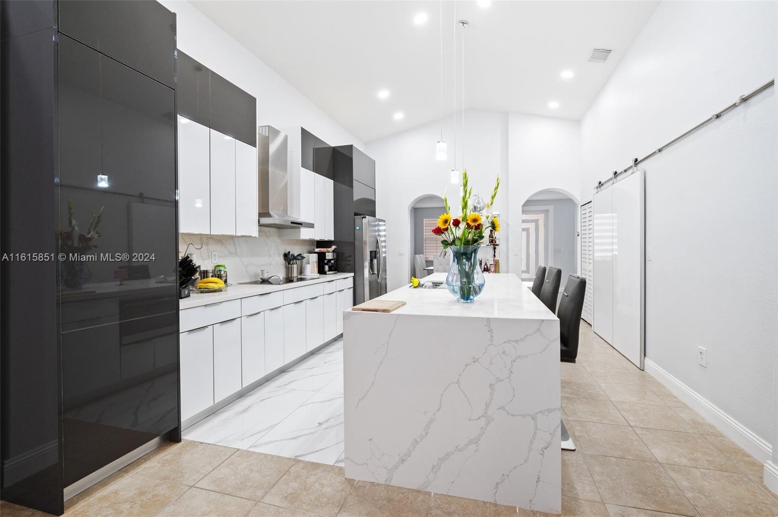 24044 Southwest 107th Court Homestead, FL 33032 - Photo 9 of 26 a kitchen that has a lot of cabinets in it and appliances