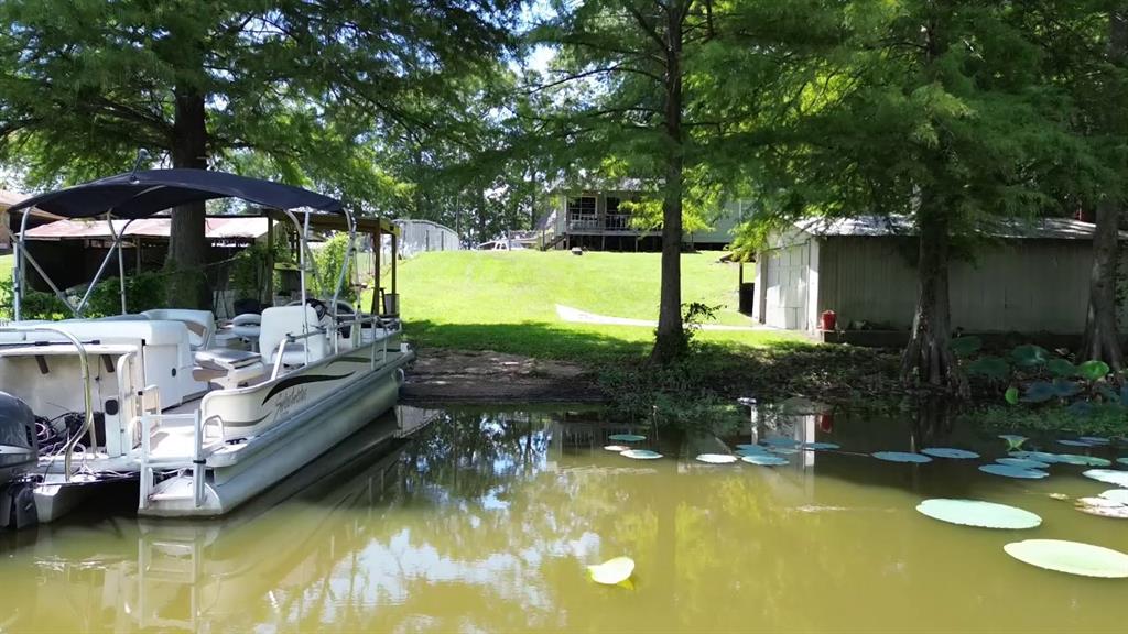 841 Dogwood Trail Logansport, LA 71049 - Photo 1 of 40 a view of a swimming pool with a patio and a yard