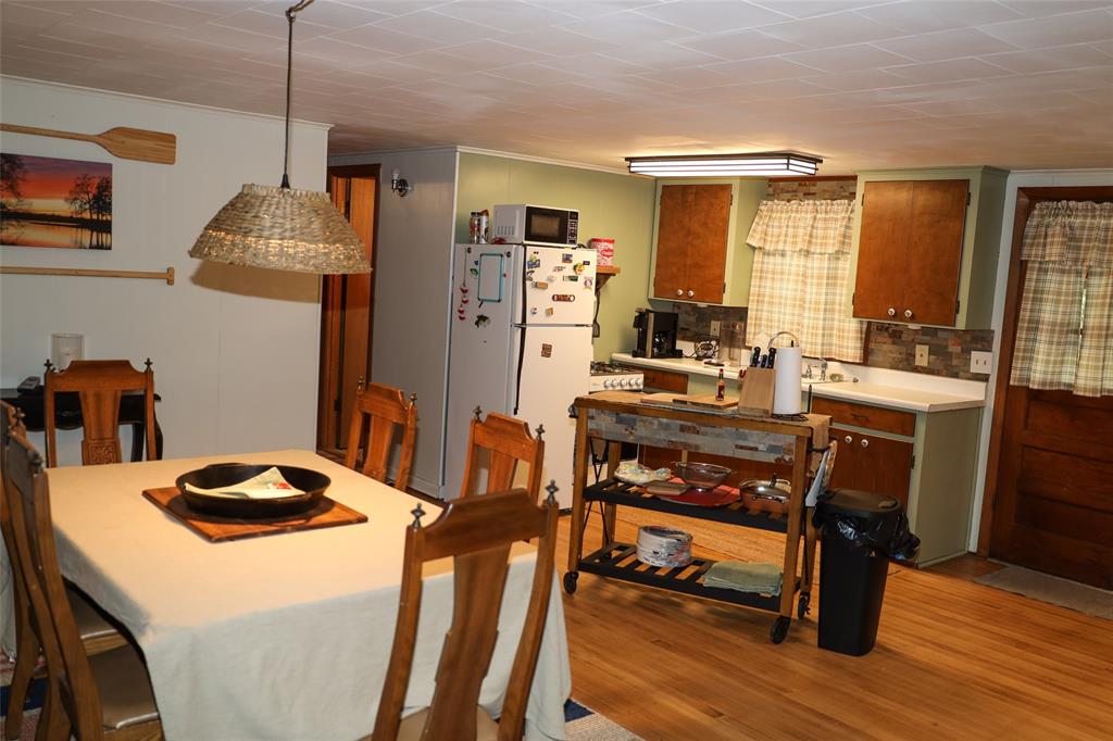 841 Dogwood Trail Logansport, LA 71049 - Photo 12 of 40 a room with furniture a flat screen tv and a table