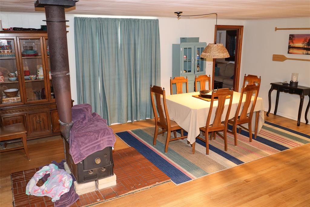 841 Dogwood Trail Logansport, LA 71049 - Photo 15 of 40 a view of a dining room with furniture window and wooden floor