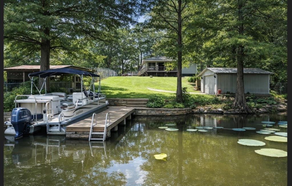 841 Dogwood Trail Logansport, LA 71049 - Photo 2 of 40 a view of house with swimming pool and outdoor seating