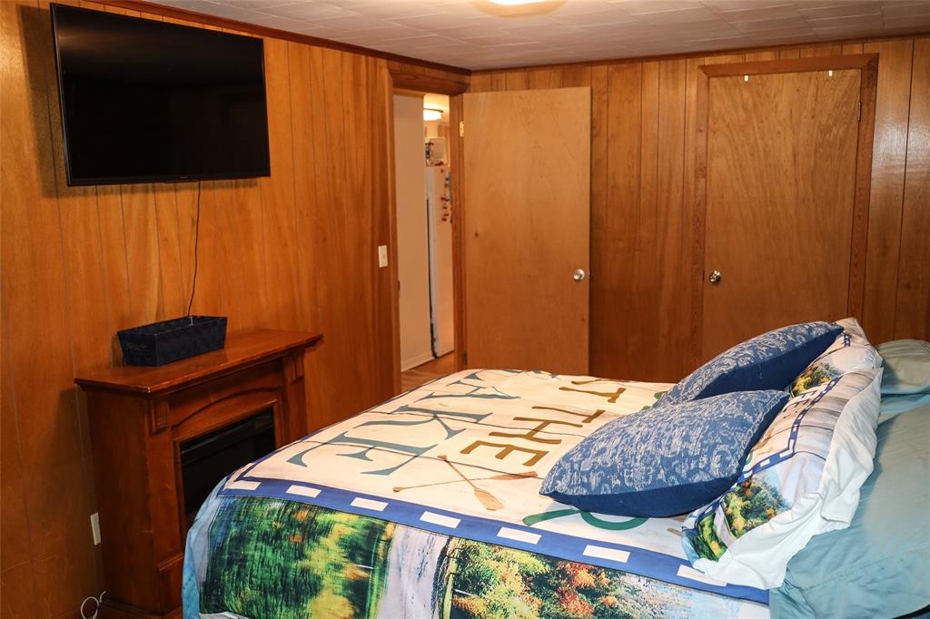 841 Dogwood Trail Logansport, LA 71049 - Photo 22 of 40 a bedroom with a bed and a television
