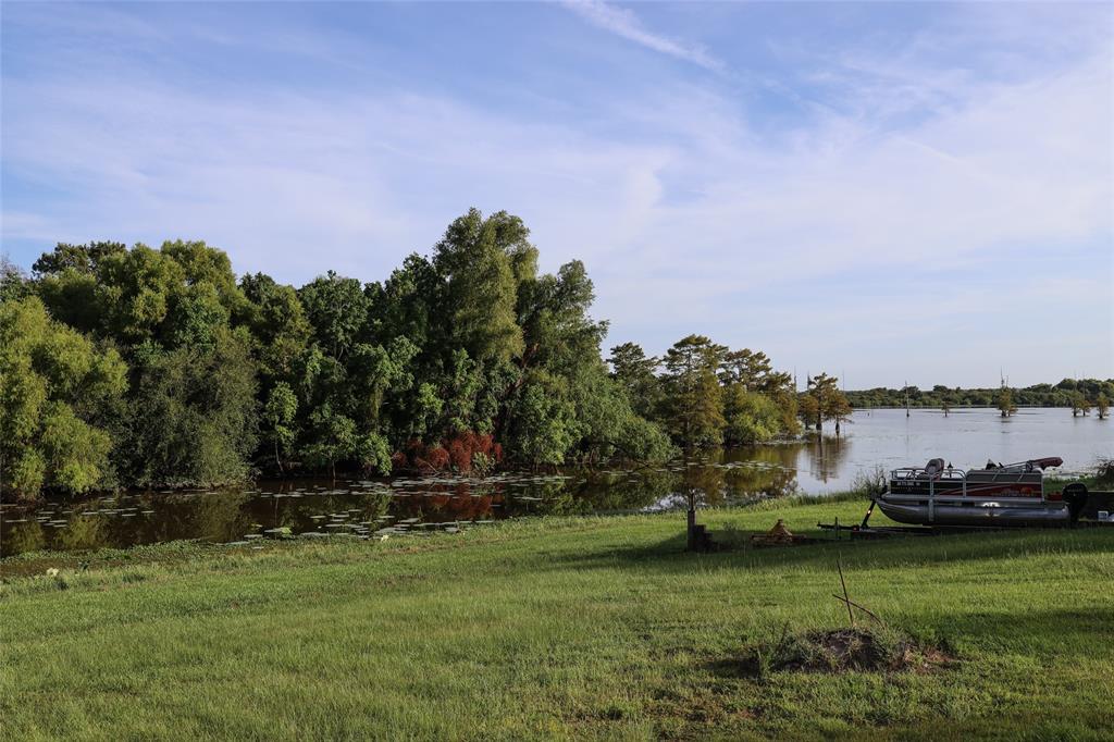841 Dogwood Trail Logansport, LA 71049 - Photo 28 of 40 a view of a golf course with a lake