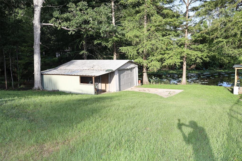 841 Dogwood Trail Logansport, LA 71049 - Photo 29 of 40 a view of a house with a yard and sitting area