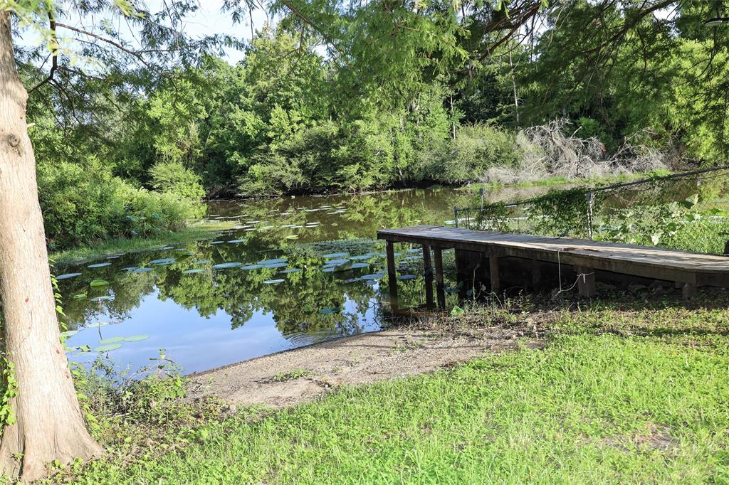 841 Dogwood Trail Logansport, LA 71049 - Photo 33 of 40 a wooden fence with a lake view