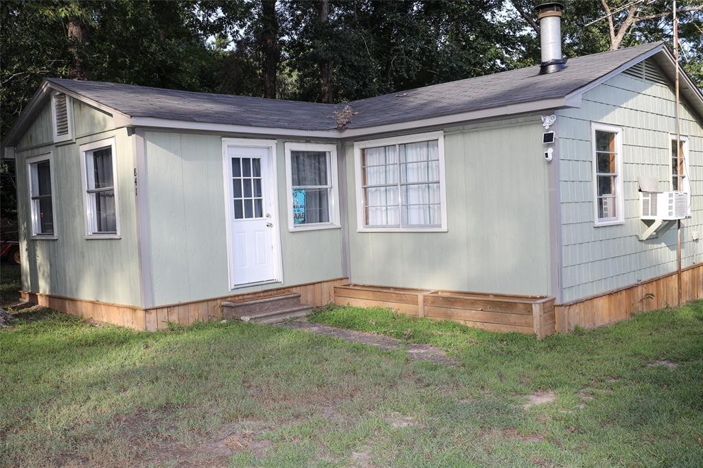 841 Dogwood Trail Logansport, LA 71049 - Photo 6 of 40 a view of a house with backyard and garden
