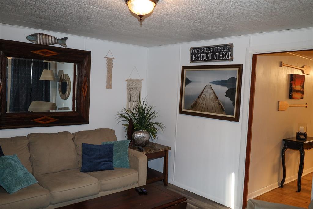 841 Dogwood Trail Logansport, LA 71049 - Photo 9 of 40 a living room with furniture and a potted plant
