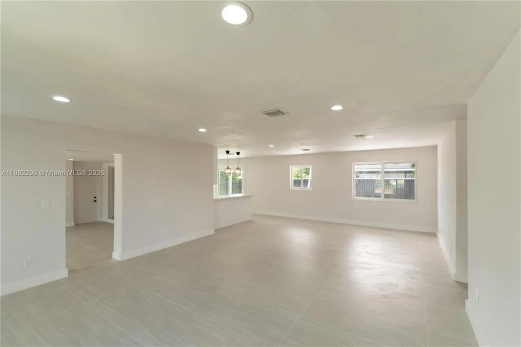 11872 Southwest 196th Terrace Miami, FL 33177 - Photo 13 of 15 an empty room with windows and entrance