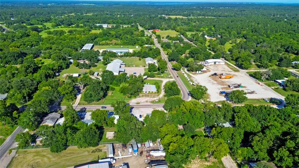 a view of a garden with a building in the background