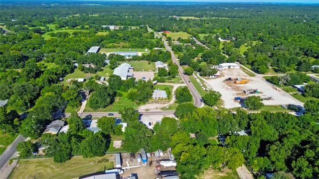 a view of a garden with a building in the background