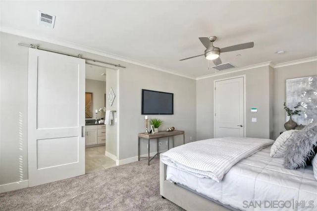 a bedroom with a bed and a chair