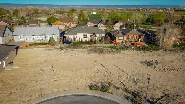 a view of swimming pool with lawn chairs