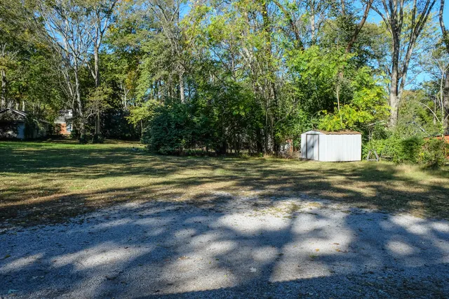 a backyard of a house with lots of green space
