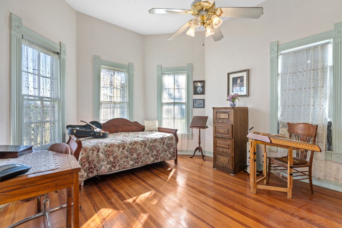 115 Fischer Store Road Fischer, TX 78623 - Photo 16 of 38 a bedroom with a bed and wooden floor