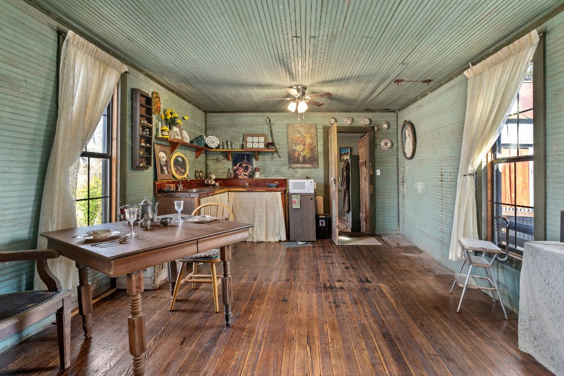 115 Fischer Store Road Fischer, TX 78623 - Photo 28 of 38 a view of a dining room with furniture window and wooden floor