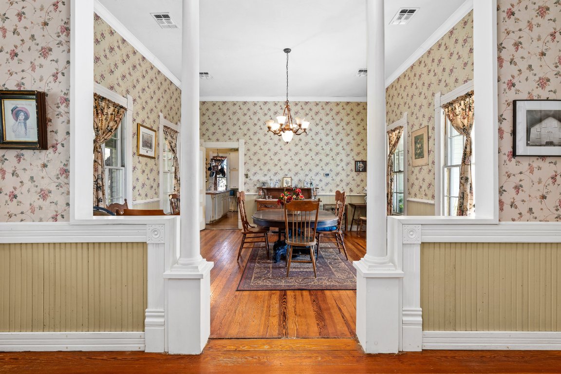 115 Fischer Store Road Fischer, TX 78623 - Photo 10 of 38 a view of a dining room with furniture a chandelier and wooden floor