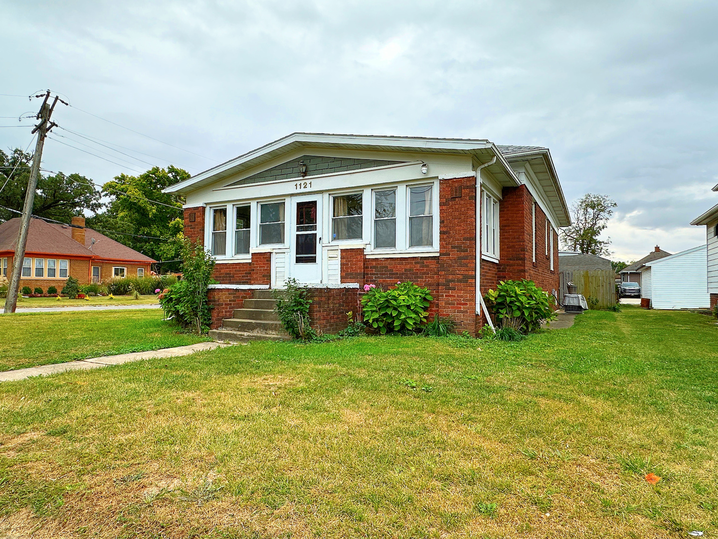 1121 East Main Street Streator, IL 61364 - Photo 17 of 22 a front view of a house with a yard
