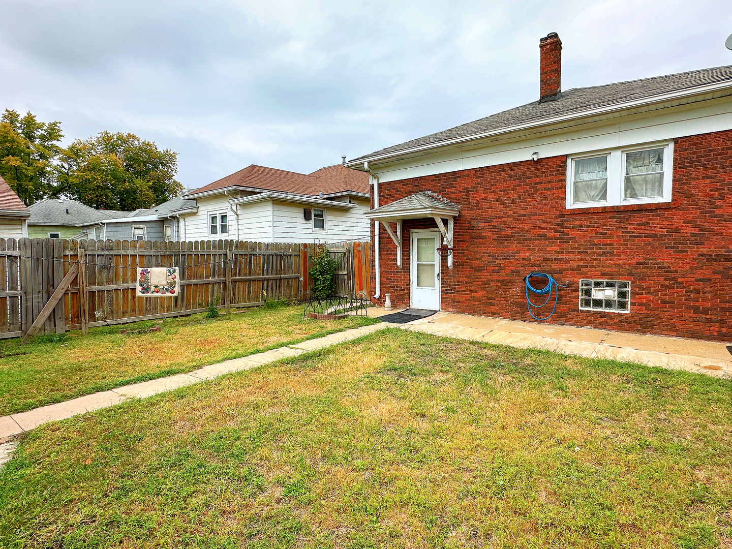 1121 East Main Street Streator, IL 61364 - Photo 20 of 22 a front view of a house with a yard
