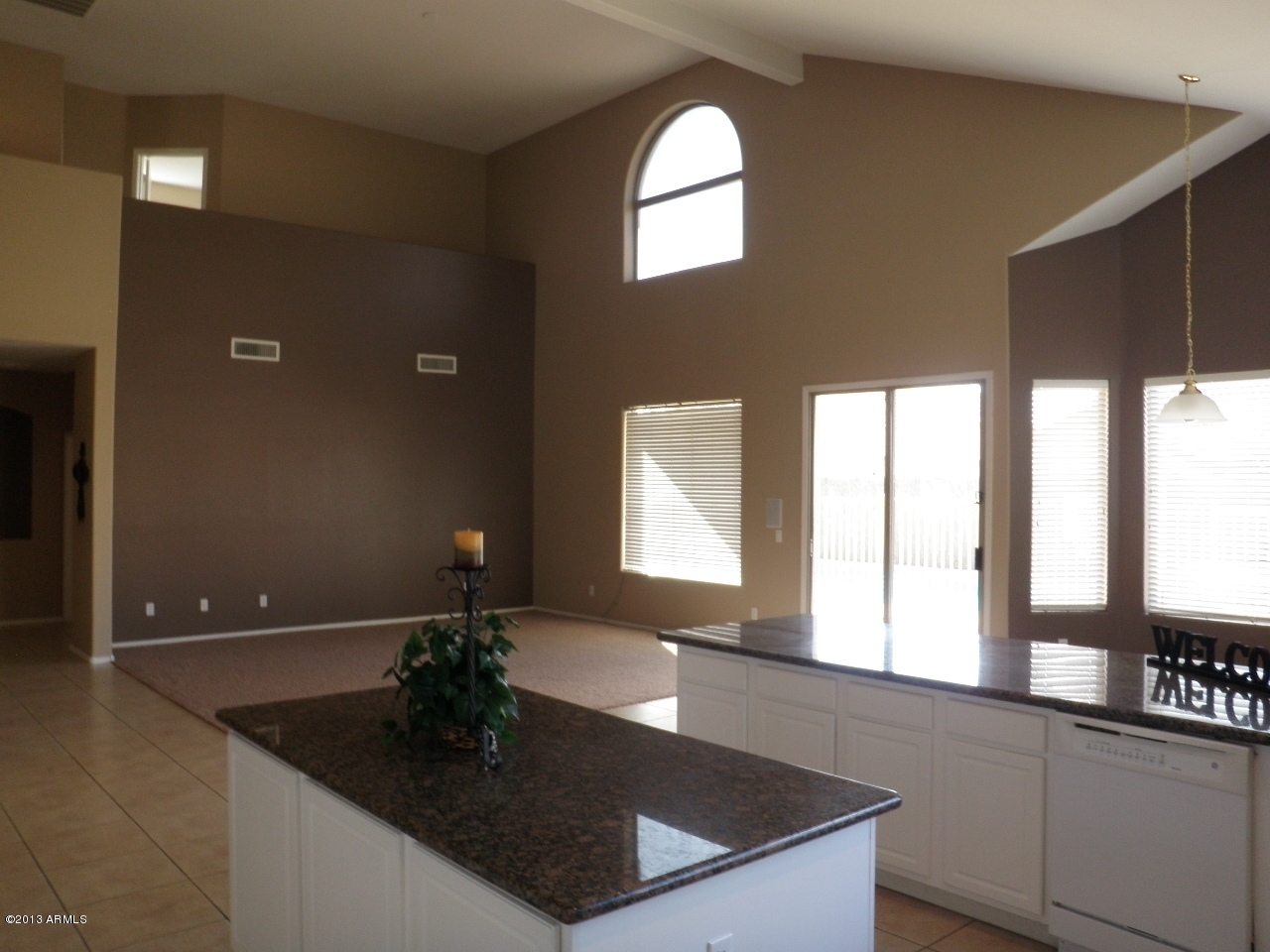 3672 South Martingale Road Gilbert, AZ 85297 - Photo 12 of 45 a kitchen with granite countertop a sink and a window