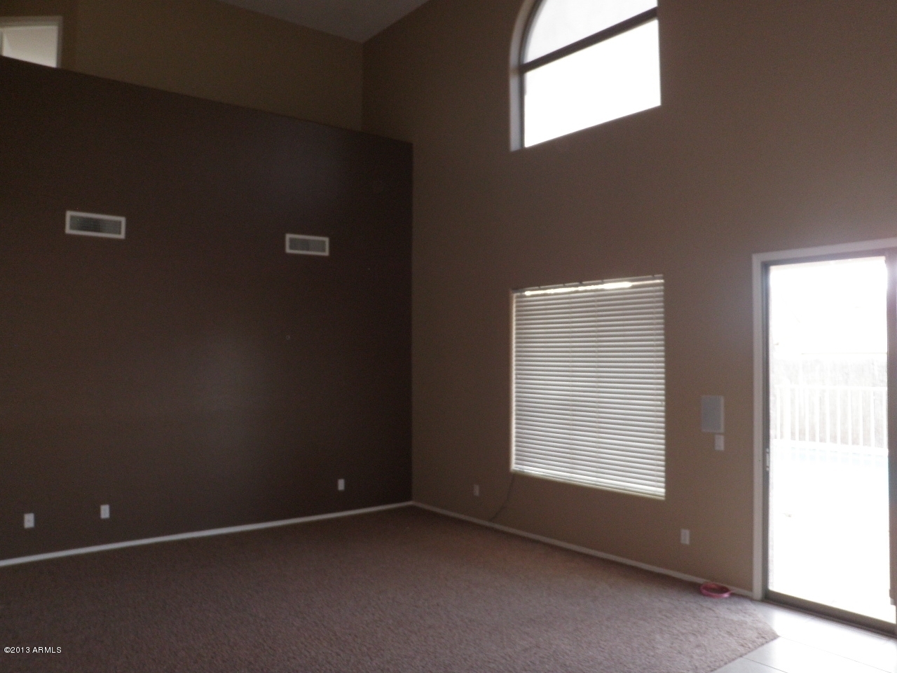 3672 South Martingale Road Gilbert, AZ 85297 - Photo 13 of 45 an empty room with a window