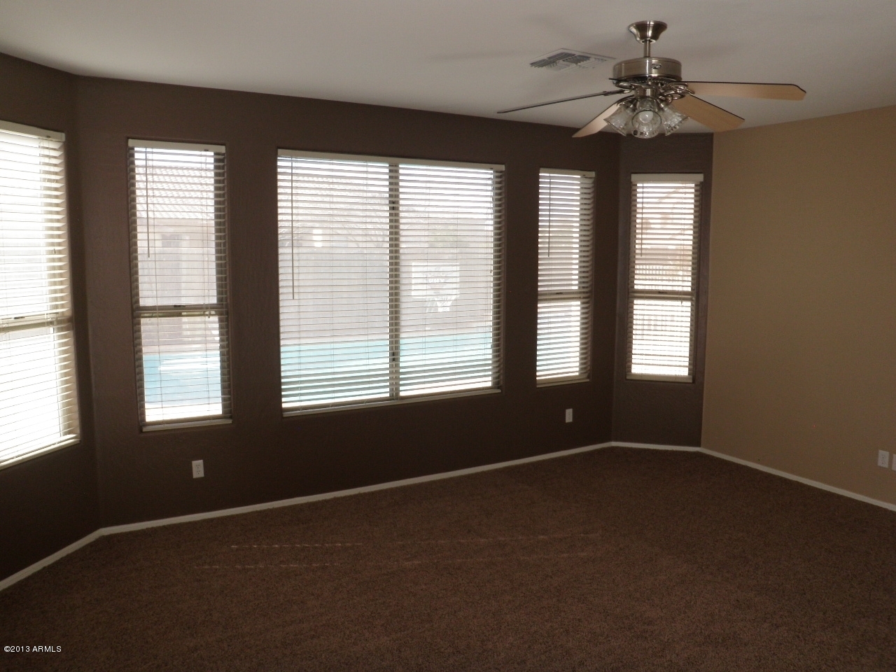 3672 South Martingale Road Gilbert, AZ 85297 - Photo 16 of 45 a view of an empty room with a window