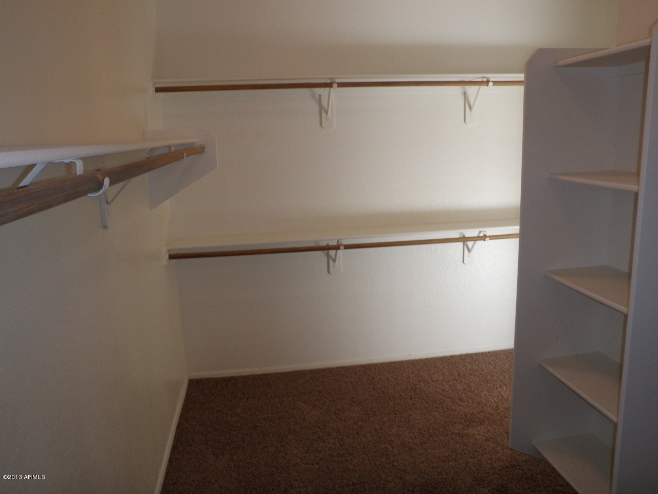 3672 South Martingale Road Gilbert, AZ 85297 - Photo 19 of 45 a view of a room with racks on the wall